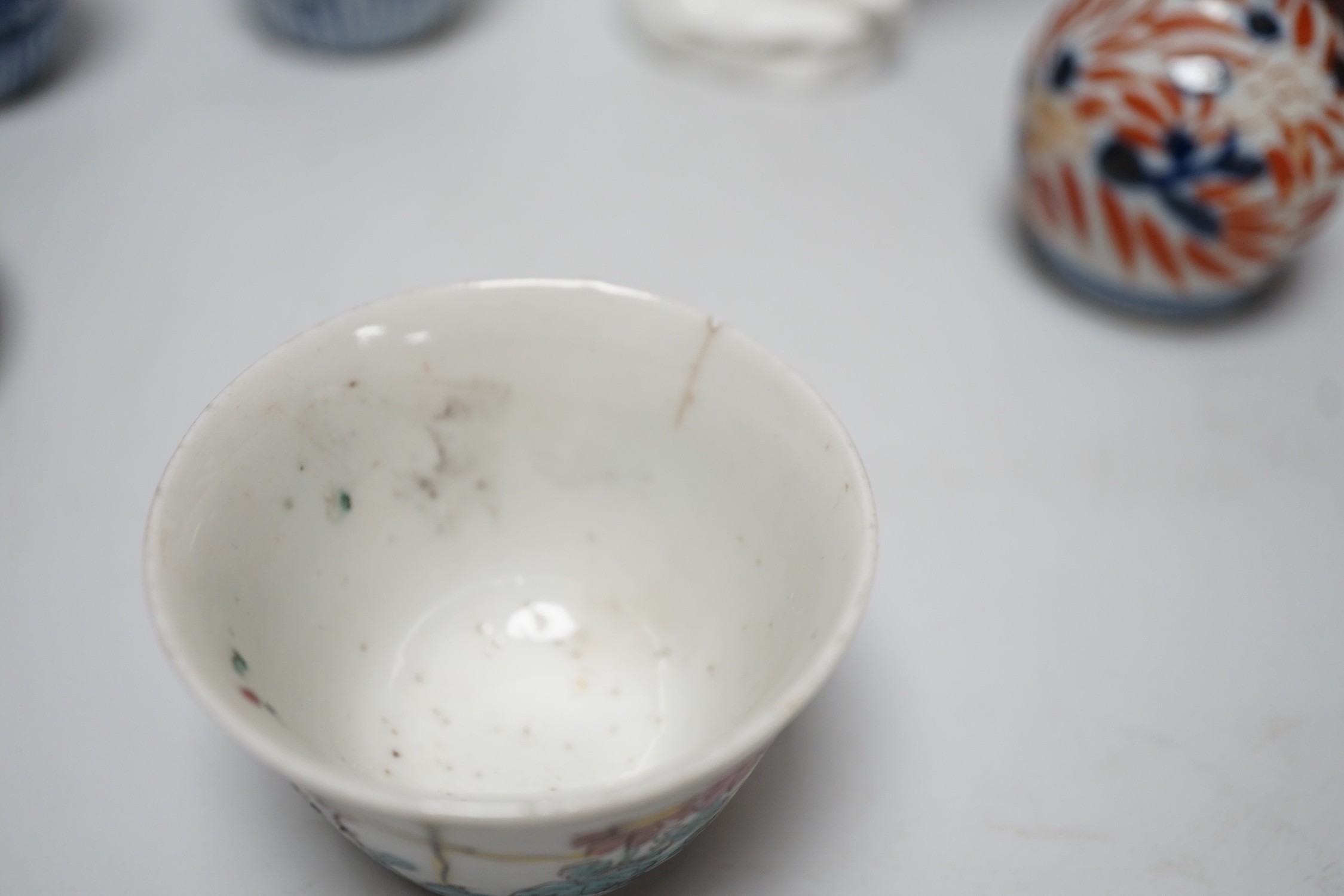 A Chinese sang de boeuf bottle neck vase, together with four Chinese miniature vases, three Chinese figures and a Chinese tea bowl, tallest 15cm